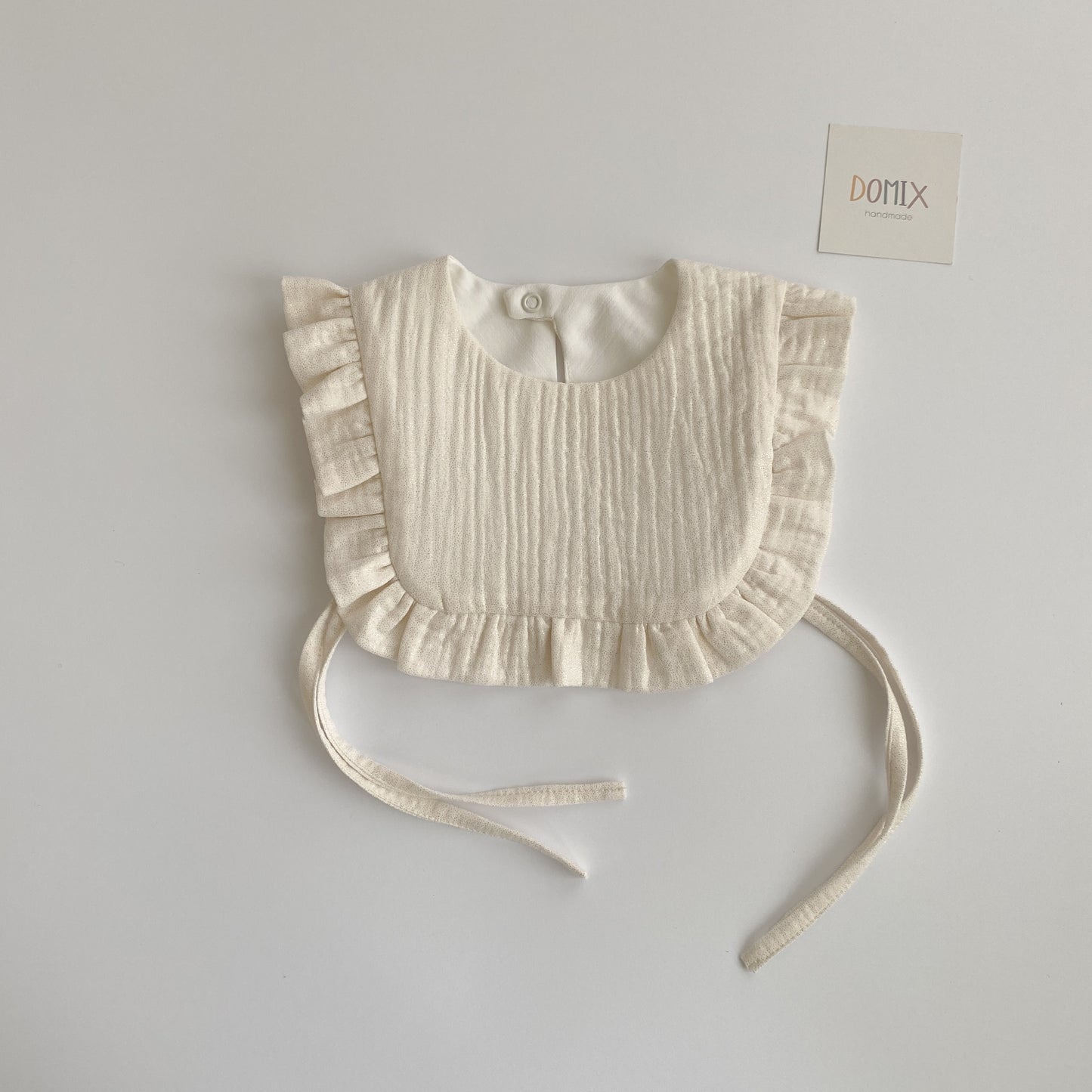 Shimmer Frill Bib