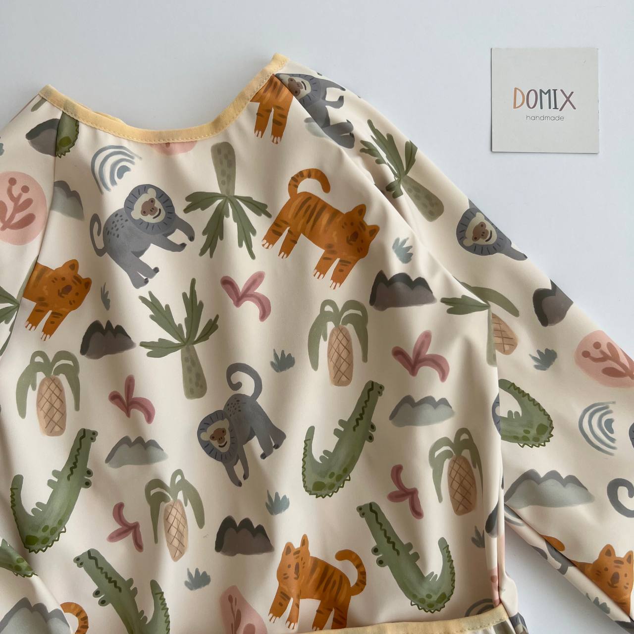 Children's long-sleeve shirt with animal pattern on a light gray background